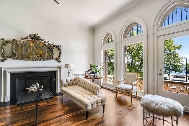 Formal living room with grand lake views. (Photo | Engel & Volkers)